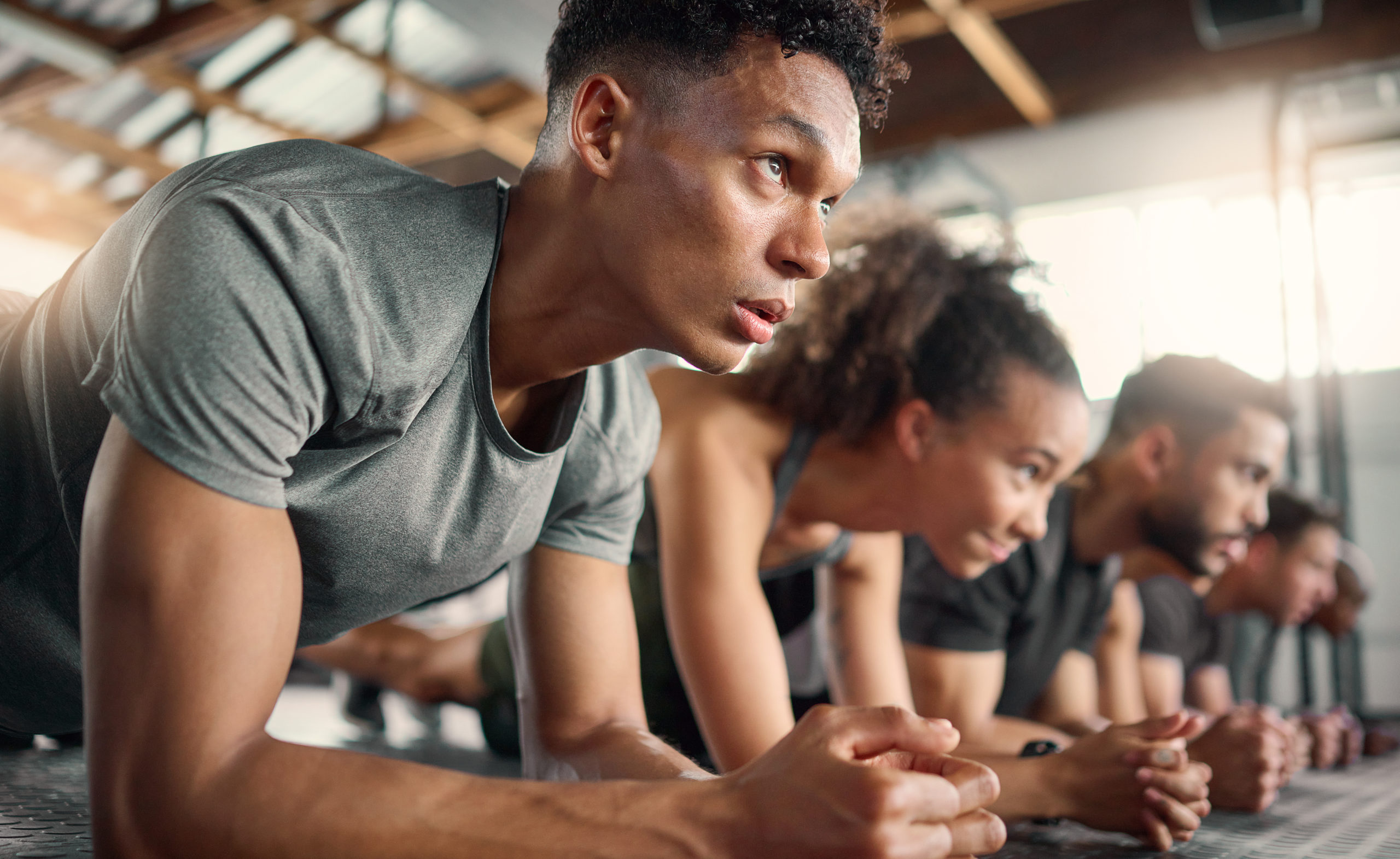 Gym, fitness and plank floor workout, challenge and power exercise by young people, focus and minds.
